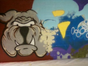 Spray paint on brick wall at The REAL School in Racine WI.